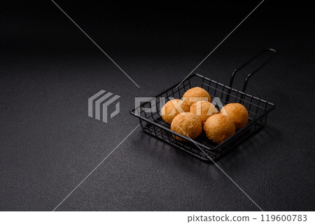 Fast food cheese balls breaded with salt and spices 119600783