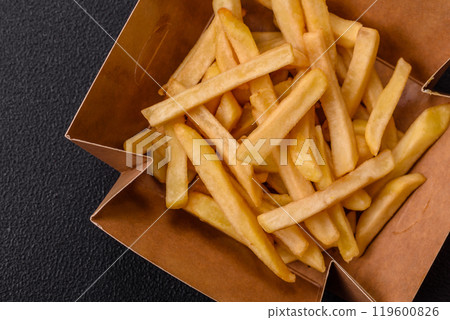 Fast food french fries with salt and spices 119600826