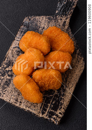 Fast food chicken nuggets breaded with salt and spices 119600908