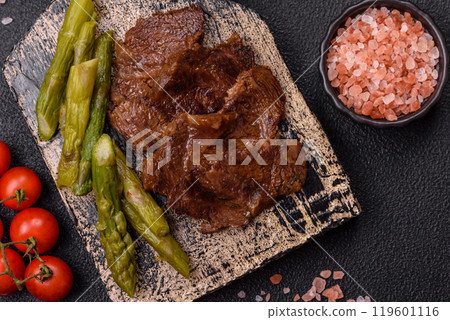 Juicy beef or pork cut into slices with boiled asparagus Juicy beef or pork cut into slices with boiled asparagus 119601116