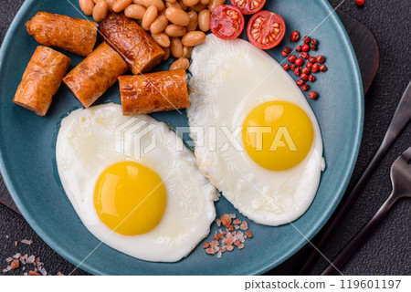 Full English breakfast with boiled eggs, beans, sausages, tomatoes Full English breakfast with boiled eggs, beans, sausages, tomatoes 119601197