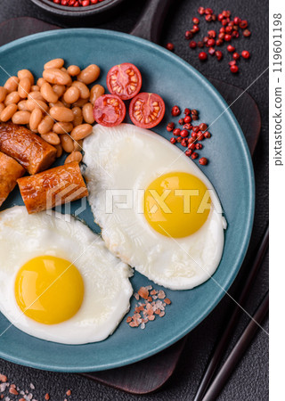 Full English breakfast with boiled eggs, beans, sausages, tomatoes 119601198