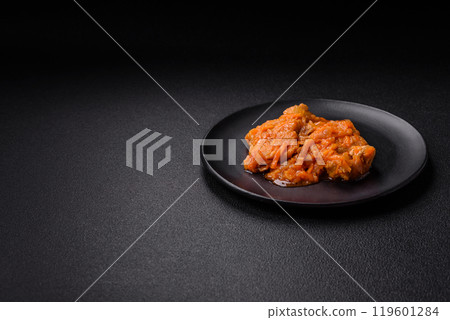 Sliced fish in tomato sauce with salt and spices 119601284