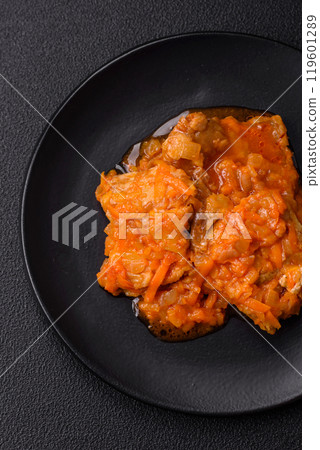 Sliced fish in tomato sauce with salt and spices 119601289