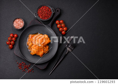 Sliced fish in tomato sauce with salt and spices Sliced fish in tomato sauce with salt and spices 119601293