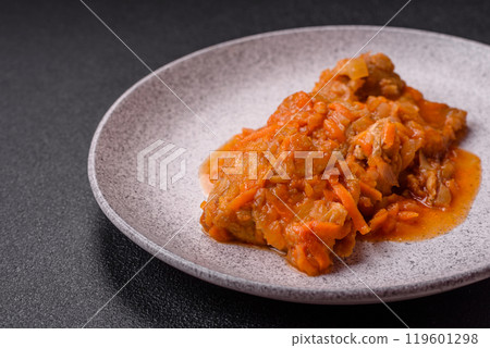Sliced fish in tomato sauce with salt and spices 119601298