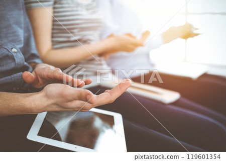 Business people clapping at meeting or conference, close-up of hands. Group of unknown businessmen and women in sunny office Business people clapping at meeting or conference, close-up of hands. Group of unknown businessmen and women in sunny office 119601354