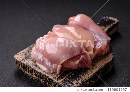Fresh chicken fillet on a dark concrete table with spices and herbs 119601367