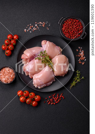 Fresh chicken fillet on a dark concrete table with spices and herbs Fresh chicken fillet on a dark concrete table with spices and herbs 119601390