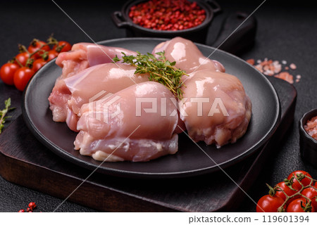 Fresh chicken fillet on a dark concrete table with spices and herbs 119601394