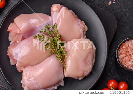 Fresh chicken fillet on a dark concrete table with spices and herbs 119601395
