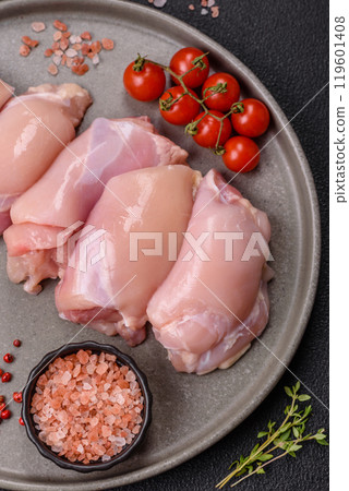 Fresh chicken fillet on a dark concrete table with spices and herbs 119601408