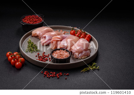 Fresh chicken fillet on a dark concrete table with spices and herbs 119601410