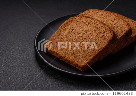 Fresh crispy brown bread sliced from whole grain flour Fresh crispy brown bread sliced from whole grain flour 119601488