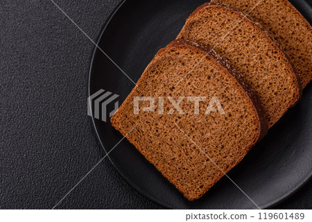 Fresh crispy brown bread sliced from whole grain flour Fresh crispy brown bread sliced from whole grain flour 119601489