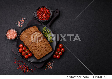 Fresh crispy brown bread sliced from whole grain flour 119601495