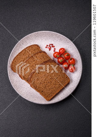 Fresh crispy brown bread sliced from whole grain flour Fresh crispy brown bread sliced from whole grain flour 119601507