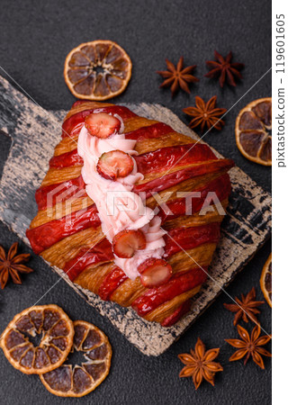 Crispy sweet red croissant with strawberry filling 119601605