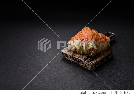 Crispy sweet red croissant with pistachio, raspberry and strawberry Crispy sweet red croissant with pistachio, raspberry and strawberry 119601622