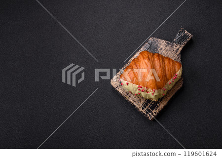 Crispy sweet red croissant with pistachio, raspberry and strawberry 119601624