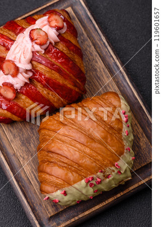 Crispy sweet red croissant with pistachio, raspberry and strawberry Crispy sweet red croissant with pistachio, raspberry and strawberry 119601657