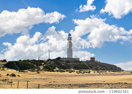Los Canos de Meca, Barbate, Cadiz; August 19, 2022: athletes practicing kitesurfing in front of the beach of the Trafalgar Lighthouse Los Canos de Meca, Barbate, Cadiz; August 19, 2022: athletes practicing kitesurfing in front of the beach of the Trafalgar Lighthouse 119602161