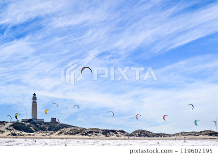 Los Canos de Meca, Barbate, Cadiz; August 19, 2022: athletes practicing kitesurfing in front of the beach of the Trafalgar Lighthouse Los Canos de Meca, Barbate, Cadiz; August 19, 2022: athletes practicing kitesurfing in front of the beach of the Trafalgar Lighthouse 119602195
