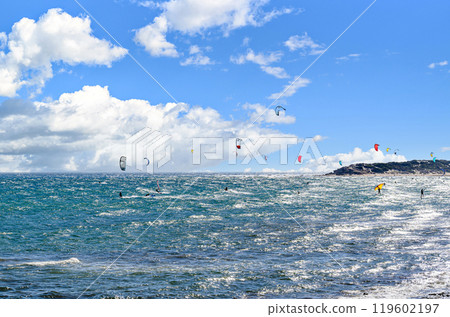 Los Canos de Meca, Barbate, Cadiz; August 19, 2022: athletes practicing kitesurfing in front of the beach of the Trafalgar Lighthouse Los Canos de Meca, Barbate, Cadiz; August 19, 2022: athletes practicing kitesurfing in front of the beach of the Trafalgar Lighthouse 119602197