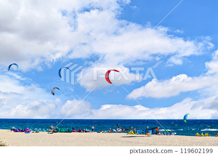 Los Canos de Meca, Barbate, Cadiz; August 19, 2022: athletes practicing kitesurfing in front of the beach of the Trafalgar Lighthouse Los Canos de Meca, Barbate, Cadiz; August 19, 2022: athletes practicing kitesurfing in front of the beach of the Trafalgar Lighthouse 119602199