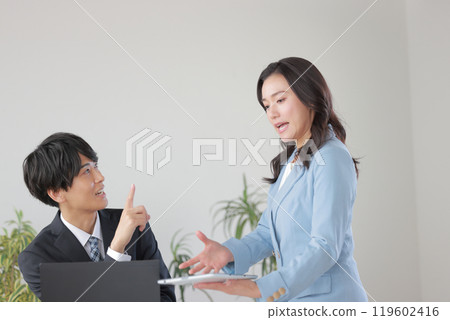 A subordinate responding to a question from his boss 119602416