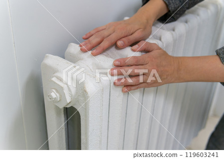 house white radiator domestic battery iron heater interior home metal hands warm equipment 119603241