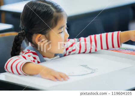 Elementary school students taking lessons in a classroom 119604105
