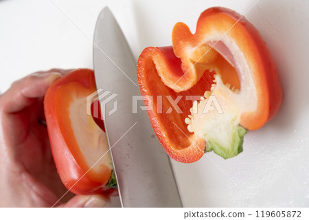 Cut the paprika with a knife 119605872