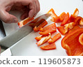 Slice the paprika with a knife 119605873