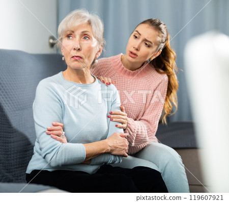 Offended senior mother and daughter encouraging her 119607921