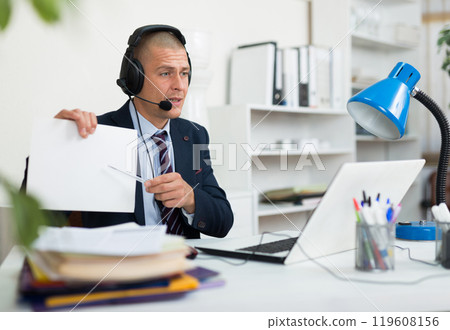 Legal counsel consulting his client via video call 119608156