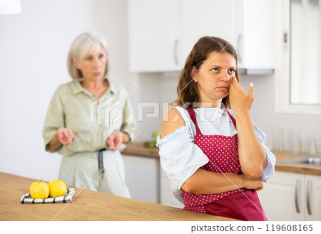 Offended woman quarreling with her old mother at home 119608165