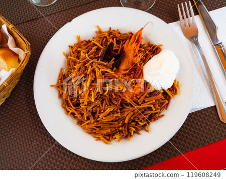 Tasty noodles with prawns and mussels with sauce Tasty noodles with prawns and mussels with sauce 119608249