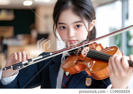 Student playing music instrument at the school music room Student playing music instrument at the school music room 119608889