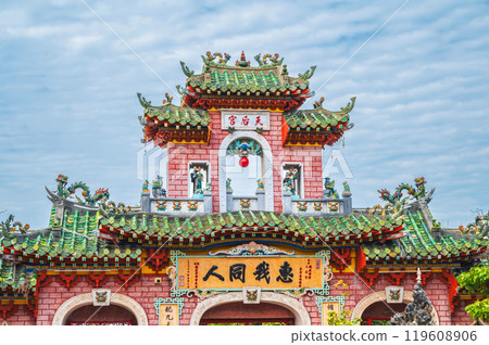 Beautiful Asian gate to the Hoi Quan Phu Kien Buddhist pagoda with a temple in old town in Hoi An in Vietnam in Asia Beautiful Asian gate to the Hoi Quan Phu Kien Buddhist pagoda with a temple in old town in Hoi An in Vietnam in Asia 119608906