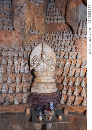 Buddhist Buddha statue and altar inside Asian temple in the Am Phu Cave in Marble Mountains in Da Nang in Vietnam 119608952