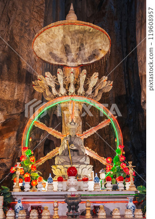 Buddhist Buddha statue and altar inside Asian sacred temple in Am Phu Cave in the Marble Mountains in Da Nang in Vietnam Buddhist Buddha statue and altar inside Asian sacred temple in Am Phu Cave in the Marble Mountains in Da Nang in Vietnam 119608957