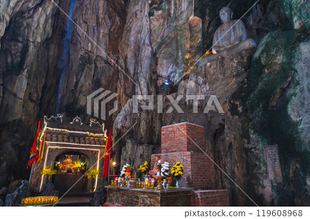 interior of the Vietnamese sacred Buddhist temple inside Huyen Huong Cave in the Marble Mountains in Da Nang in Vietnam in Asia 119608968