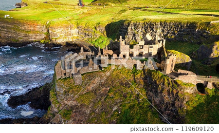 Dunluce Castle in Northern Ireland aerial view - Ancient Ruins Majestically Overlooking the Glorious 119609120