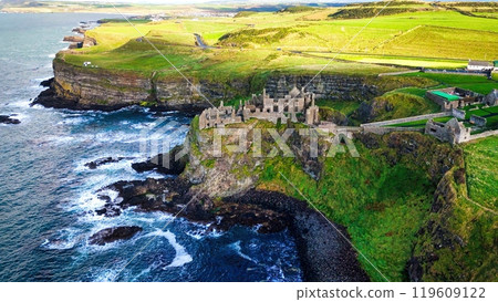 Dunluce Castle in Northern Ireland aerial view - Ancient Ruins Majestically Overlooking the Glorious 119609122