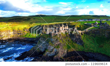 Dunluce Castle in Northern Ireland aerial view - Ancient Ruins Majestically Overlooking the Glorious 119609614