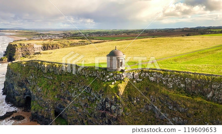 Mussenden Temple at the west coast of Northern Ireland in an enchanting Coastal Landscape featuring Mussenden Temple at the west coast of Northern Ireland in an enchanting Coastal Landscape featuring 119609653