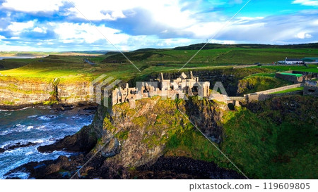 Dunluce Castle in Northern Ireland aerial view - Ancient Ruins Majestically Overlooking the Glorious 119609805