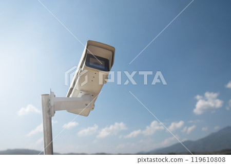 ip cctv camera installed on high pole to do the security by monitoring through mobile phone and computer to save human life and property, soft and selecitve focus. ip cctv camera installed on high pole to do the security by monitoring through mobile phone and computer to save human life and property, soft and selecitve focus. 119610808