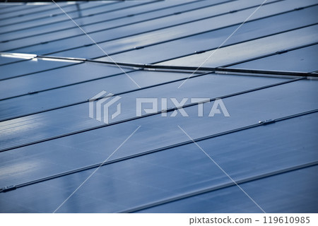 closeup photovoltaic panels which installed on the rooftop of the building, concept for storing and using natural power from the sunlight to care about human environment over the world. 119610985